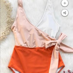 Brand new with tags attached one piece swim suit
